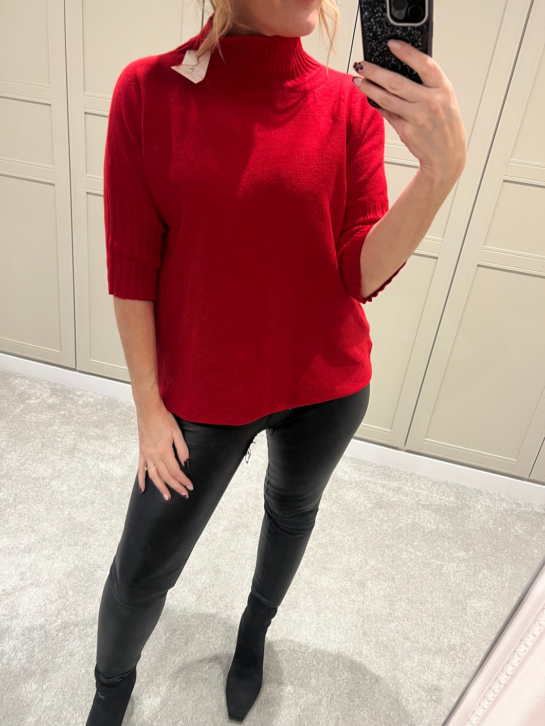 Red ribbed polo neck jumper
